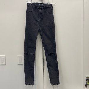 Zara black skinny jeans with slit knees. Excellent condition.